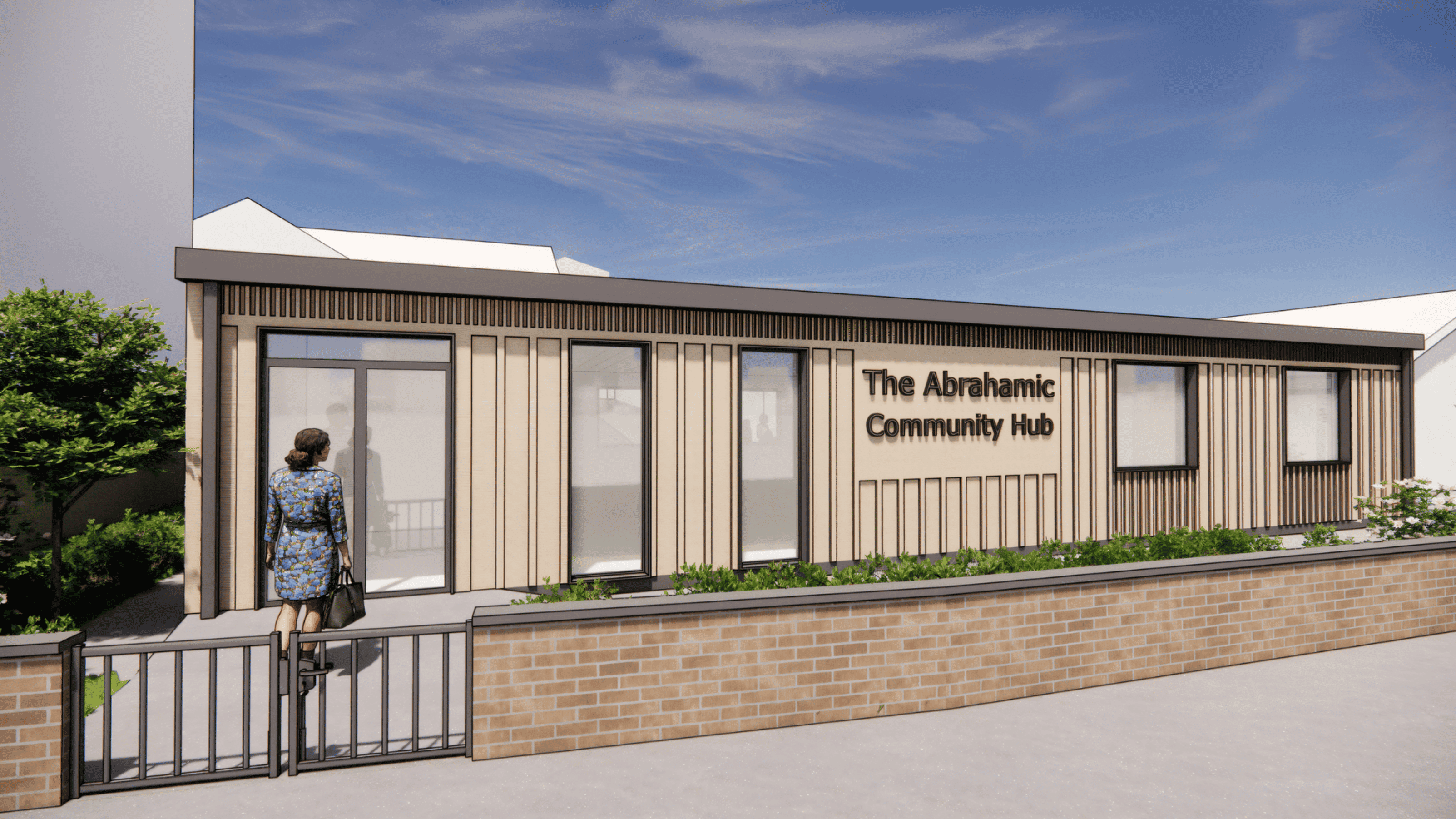 Front view of The Abrahamic Community Hub at 215 High Street, Smethwick, designed by Lapworth Architects. The image shows the contemporary timber-clad façade with full-height glazing and landscaped forecourt.